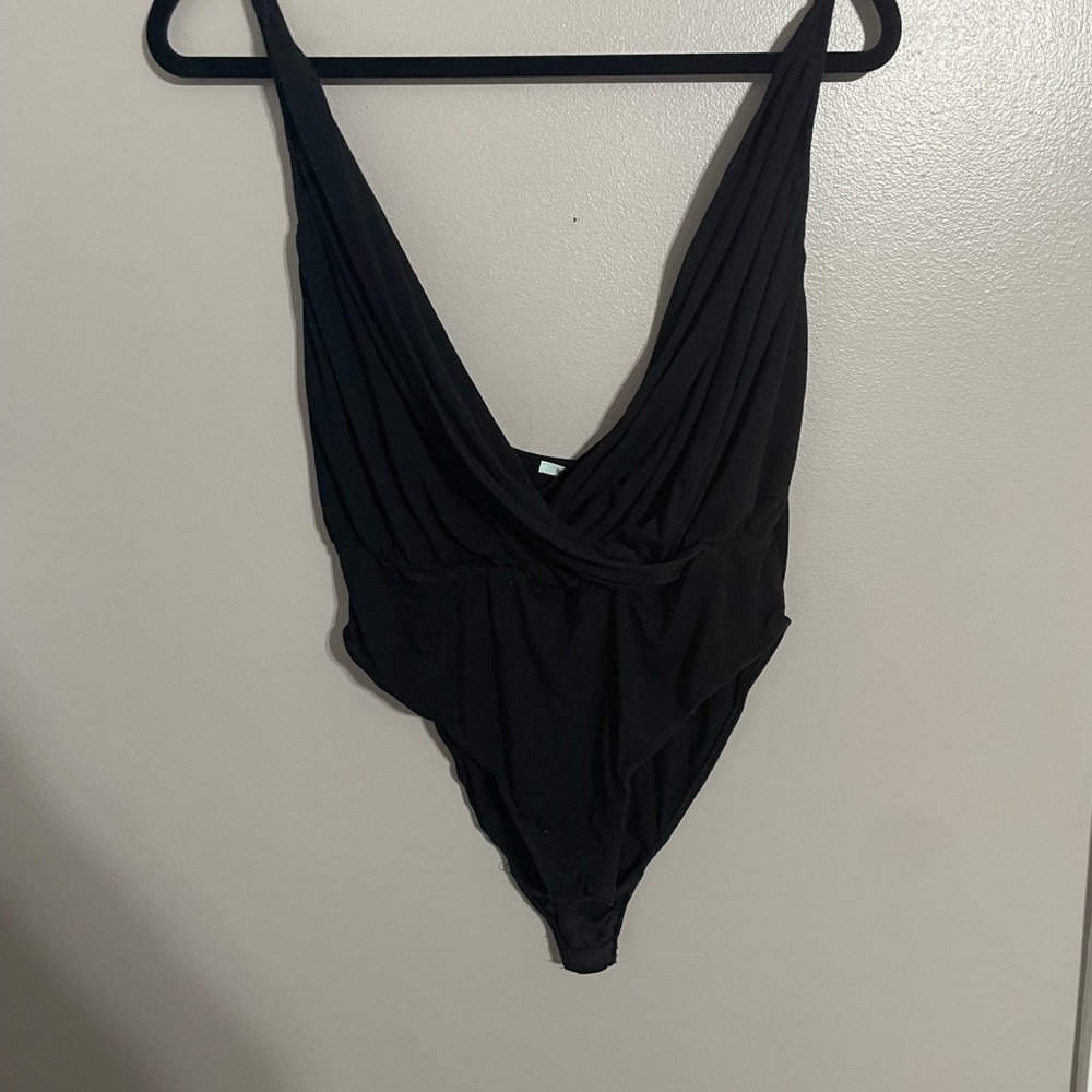 Deep V, cross cross body suit